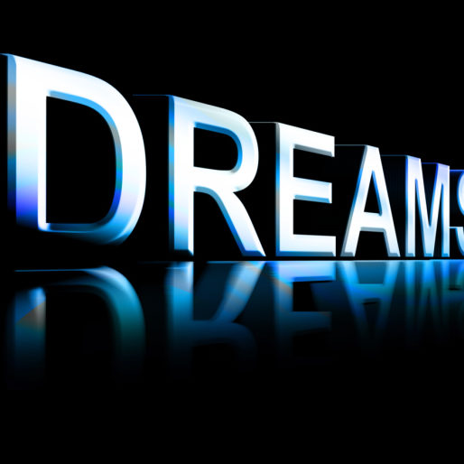 Dreams word with blue effects over black background